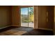 Bedroom with sliding glass door to balcony with views of green landscape at 1219 Diamond Valley St, Henderson, NV 89052