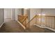 Upstairs hallway with carpet and wood railing at 1219 Diamond Valley St, Henderson, NV 89052