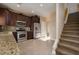 Modern kitchen with stainless steel appliances and adjacent staircase at 1219 Diamond Valley St, Henderson, NV 89052