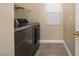 Modern washer and dryer in a bright laundry room with a window and white trim at 1219 Diamond Valley St, Henderson, NV 89052