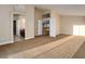 A bright, large, open-plan living room with staircase, an open doorway, and natural lighting at 1219 Diamond Valley St, Henderson, NV 89052