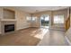 Inviting living room with a fireplace, and sliding doors leading to the outdoor space at 1219 Diamond Valley St, Henderson, NV 89052