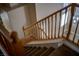 Carpeted staircase with wooden banister leading to the upper level at 1219 Diamond Valley St, Henderson, NV 89052