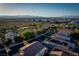 Scenic aerial view of a residential neighborhood with mountain views and nearby commercial areas at 1219 Diamond Valley St, Henderson, NV 89052