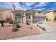 Beautiful two-story home boasting a well-manicured front yard and a spacious three-car garage at 13 White Tail Ct, Henderson, NV 89074