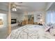 Cozy main bedroom with a fireplace, canopy bed, and natural light at 13 White Tail Ct, Henderson, NV 89074