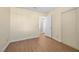 Bedroom featuring wood-look floors, closet, and neutral decor at 1701 Santa Rosalia Dr, North Las Vegas, NV 89031