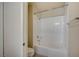 Well-lit bathroom featuring a clean white bathtub with shower and modern fixtures at 20 E Serene Ave # 304, Las Vegas, NV 89123