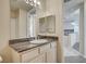 Well-lit bathroom featuring granite countertop and a view to another room at 20 E Serene Ave # 304, Las Vegas, NV 89123