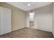 Bedroom with wood-look floors and a doorway to the bathroom at 20 E Serene Ave # 304, Las Vegas, NV 89123