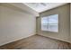 Bedroom with wood-look floors, natural light from large windows and neutral paint at 20 E Serene Ave # 304, Las Vegas, NV 89123