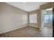 This bedroom features wood-look floors, a modern fan and plentiful natural light at 20 E Serene Ave # 304, Las Vegas, NV 89123