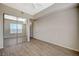 This bedroom features wood-look floors, a mirrored closet, and ample natural light at 20 E Serene Ave # 304, Las Vegas, NV 89123