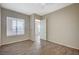 This bedroom features wood-look floors, natural light and an attached bathroom at 20 E Serene Ave # 304, Las Vegas, NV 89123