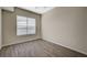 Bright, empty bedroom with plank flooring and a large window at 20 E Serene Ave # 304, Las Vegas, NV 89123