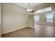 Open dining room with wood floors, neutral paint, and contemporary chandelier at 20 E Serene Ave # 304, Las Vegas, NV 89123