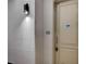 Hallway with apartment number 304 showing a light fixture and door at 20 E Serene Ave # 304, Las Vegas, NV 89123