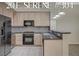 Modern kitchen with granite counters, stainless steel appliances, and ample cabinet space at 20 E Serene Ave # 304, Las Vegas, NV 89123