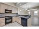 Open kitchen with granite countertops, tiled backsplash, and stainless steel appliances at 20 E Serene Ave # 304, Las Vegas, NV 89123
