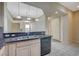 Kitchen with granite countertops, stainless steel appliances, and eat-in counter at 20 E Serene Ave # 304, Las Vegas, NV 89123