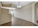 Spacious living room featuring wood floors, neutral paint and modern lighting at 20 E Serene Ave # 304, Las Vegas, NV 89123