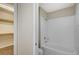 Well-lit bathroom featuring a toilet and bathtub with a shower head at 20 Serene Ave # 201, Las Vegas, NV 89123