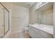 Bathroom features a glass shower, white vanity, and neutral tile floors at 20 Serene Ave # 201, Las Vegas, NV 89123