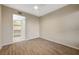 Bedroom with a large walk-in closet and light wood-look floors at 20 Serene Ave # 201, Las Vegas, NV 89123