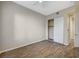 Spacious bedroom with hardwood floors, closet, and neutral paint scheme at 20 Serene Ave # 201, Las Vegas, NV 89123