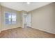 Bedroom with a large window and light wood-look floors at 20 Serene Ave # 201, Las Vegas, NV 89123