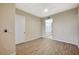 Bedroom with walk in closet and light wood-look floors at 20 Serene Ave # 201, Las Vegas, NV 89123