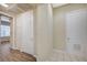 Hallway featuring hardwood floors and white doors leading to other rooms at 20 Serene Ave # 201, Las Vegas, NV 89123