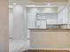 View of kitchen with granite counters, white cabinetry, and stainless steel appliances at 20 Serene Ave # 201, Las Vegas, NV 89123