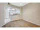 Open concept living room showing the kitchen with white cabinetry and granite counters at 20 Serene Ave # 201, Las Vegas, NV 89123