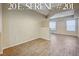 Bright living room with hardwood floors and natural light from large windows overlooking the community at 20 Serene Ave # 201, Las Vegas, NV 89123