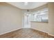 Open concept living room showing the kitchen with white cabinetry and granite counters at 20 Serene Ave # 201, Las Vegas, NV 89123