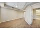 Bright living room with wood flooring, showing doorway and walk-in closet at 20 Serene Ave # 201, Las Vegas, NV 89123