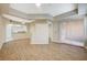 Open concept living room with wood flooring, showing the kitchen and sliding glass door at 20 Serene Ave # 201, Las Vegas, NV 89123
