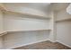 Spacious walk-in closet featuring wood floors and multiple shelves at 20 Serene Ave # 201, Las Vegas, NV 89123