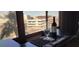 Bar area with alcohol products sitting in front of large windows providing outside views at 205 E Harmon Ave # 704, Las Vegas, NV 89169