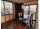 Dining area featuring city views, modern table with chairs, and laminate floor at 205 E Harmon Ave # 704, Las Vegas, NV 89169