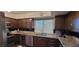 Traditional-style kitchen with granite countertops, wooden cabinets, and stainless steel appliances at 205 E Harmon Ave # 704, Las Vegas, NV 89169