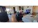 Stylish living room with comfortable seating, hardwood floors, modern decor, and dining area views at 205 E Harmon Ave # 704, Las Vegas, NV 89169