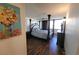 Spacious main bedroom featuring a canopy bed and ensuite bathroom with laminate floor at 205 E Harmon Ave # 704, Las Vegas, NV 89169