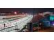 Expansive view of the Las Vegas Grand Prix race track filled with crowds in the stands at night at 205 E Harmon Ave # 704, Las Vegas, NV 89169