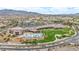 Aerial view of community recreation center showcasing multiple pools, manicured lawns, and desert landscaping at 2119 Lewiston Pl, Henderson, NV 89044