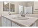Bathroom featuring double sinks, a large mirror, and ample counter space for convenience at 2119 Lewiston Pl, Henderson, NV 89044