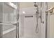 Bathroom with a tiled stand up shower and grab bar for accessibility at 2119 Lewiston Pl, Henderson, NV 89044
