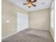 Neutral carpeted bedroom with ceiling fan and large closet at 2119 Lewiston Pl, Henderson, NV 89044