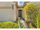Inviting entryway with a covered porch, well-maintained landscaping, and visible house number at 2119 Lewiston Pl, Henderson, NV 89044